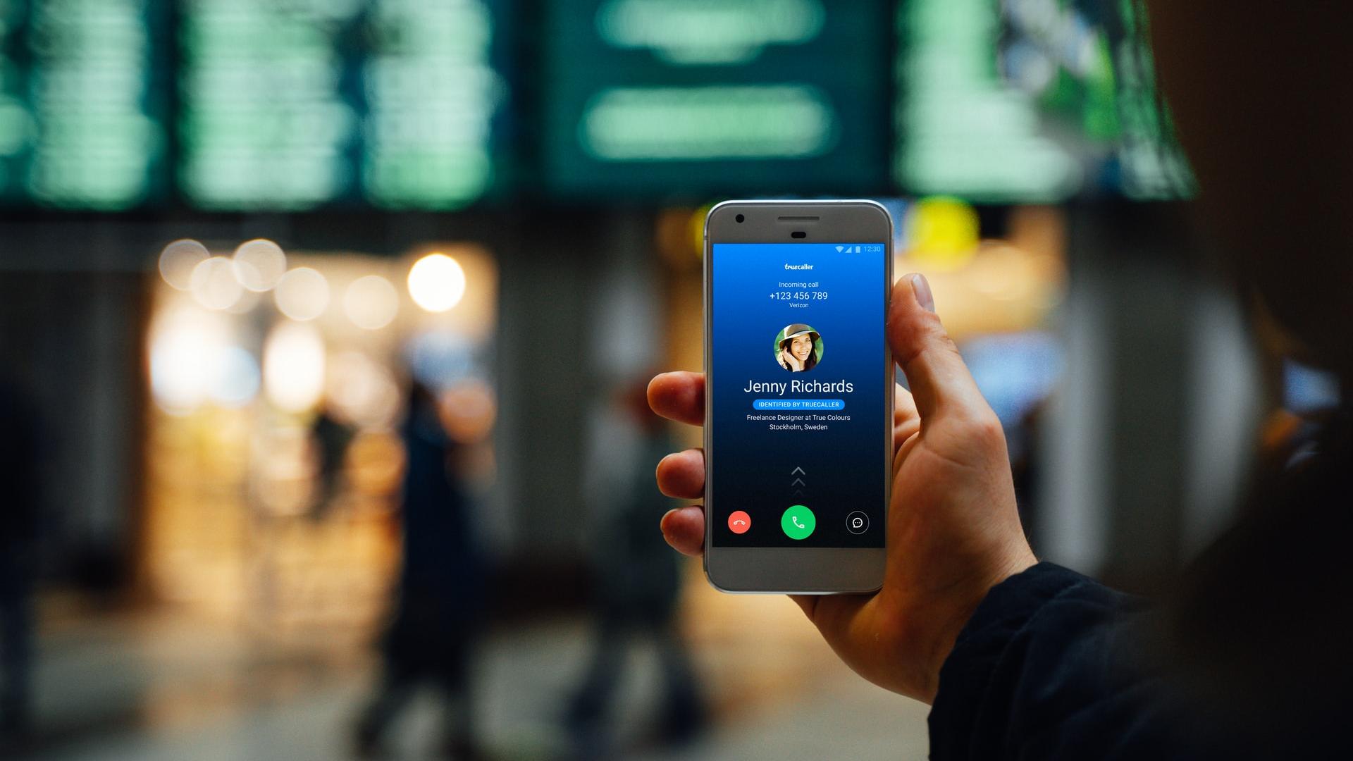 person holding silver iphone 6