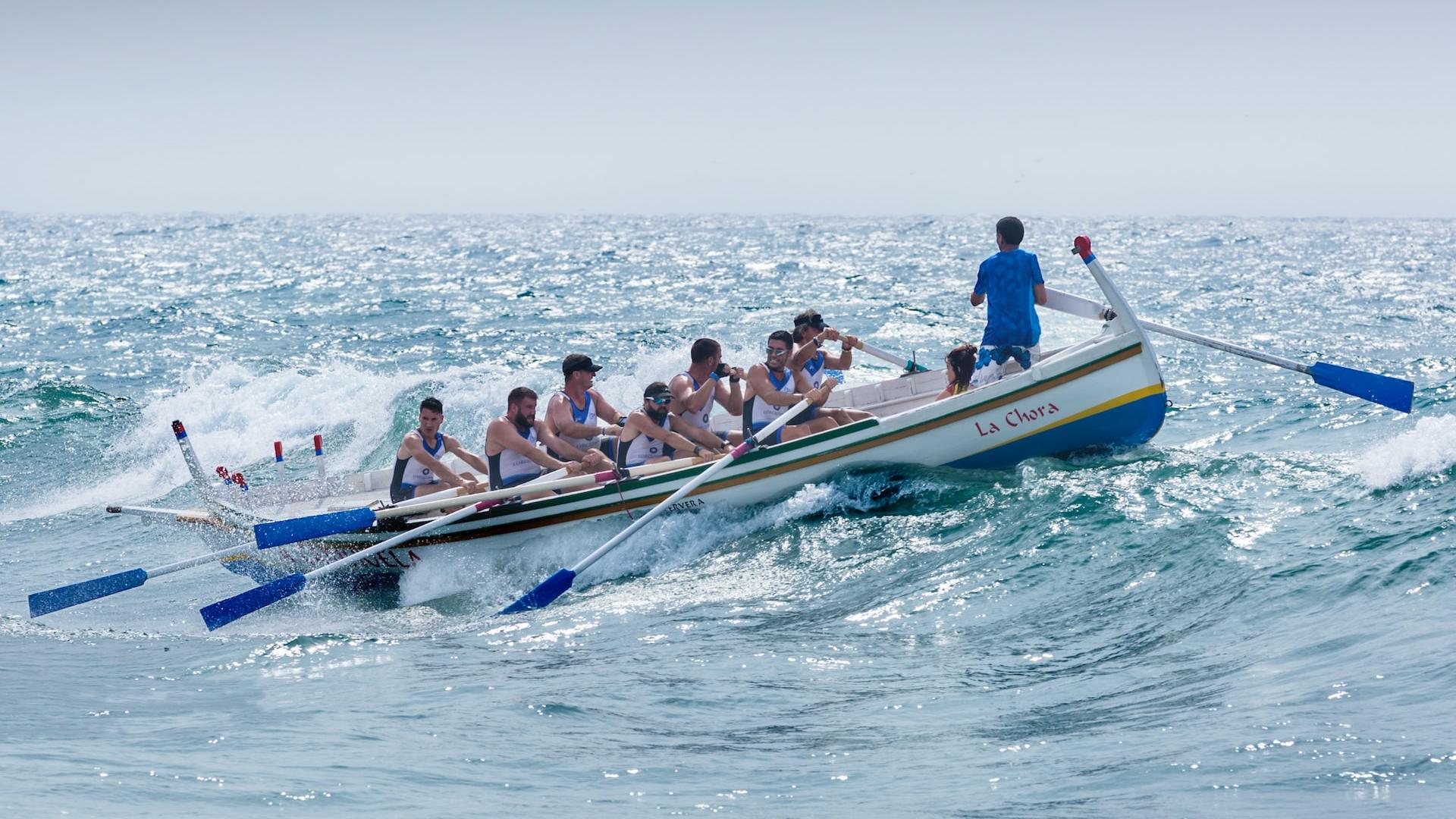 group of men riding boat